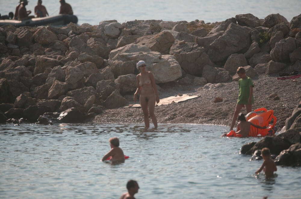 FKK cove pyramid in waters - Social Nudism Around the World