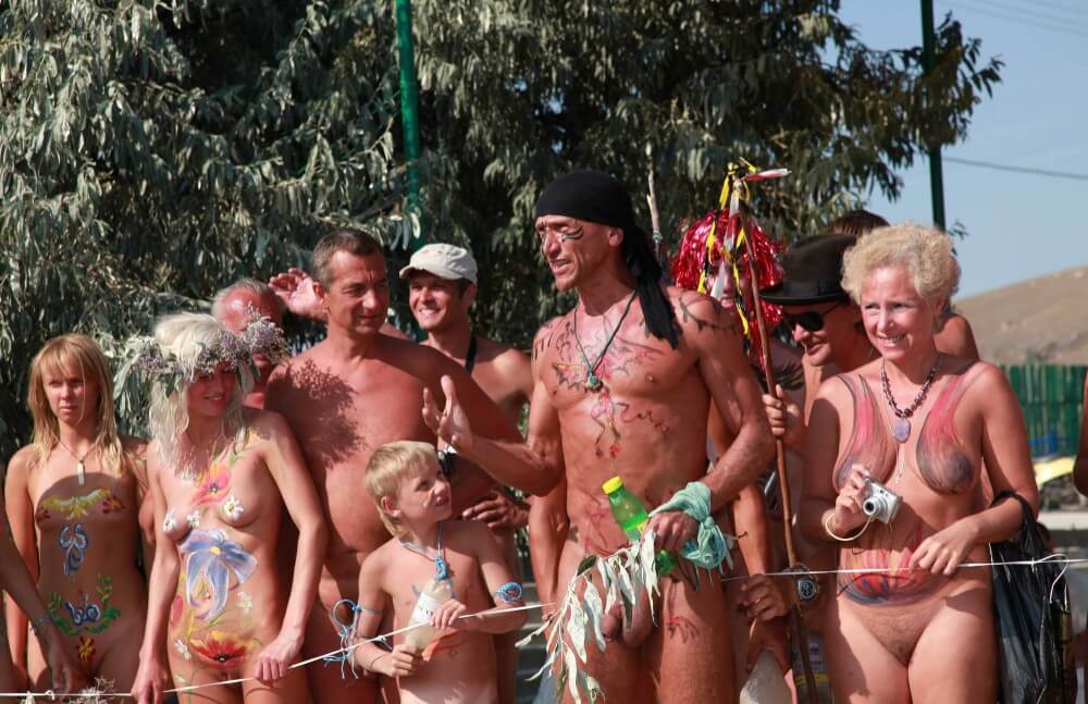 Naturist Day From Behind pics - People come together in unity with nature to take off their clothes